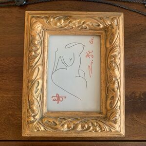 Gold decorative frame with a hand drawn picture